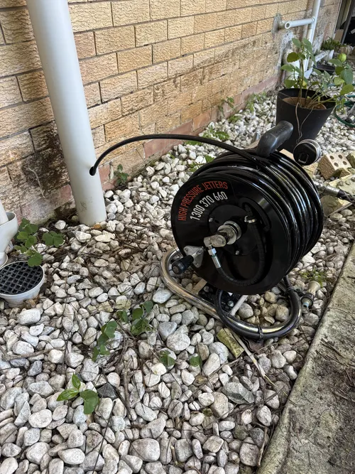 blocked drain being jet blasted at a brisbane property