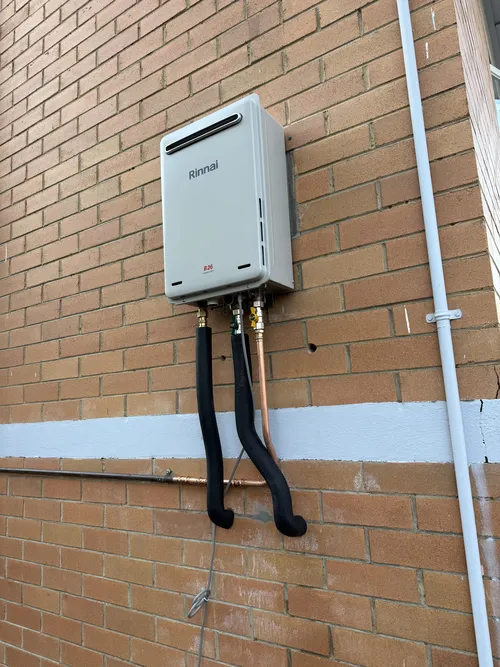 installed instant hot water system on a brisbane house